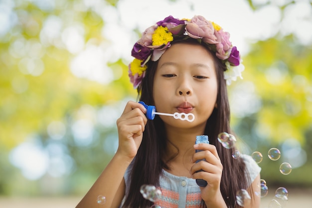 Child practicing articulation therapy with bubble activities