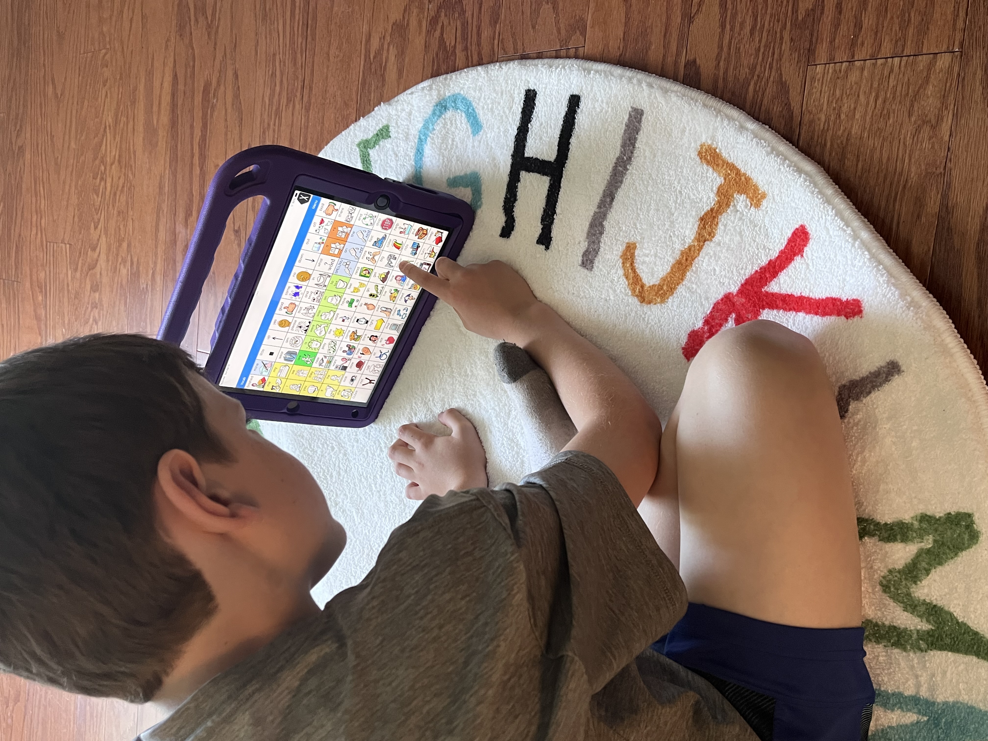 Child using AAC communication device